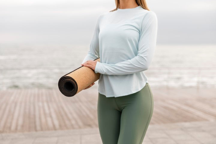 Celluvac Cork Yoga Mat Rolled Up In Arms